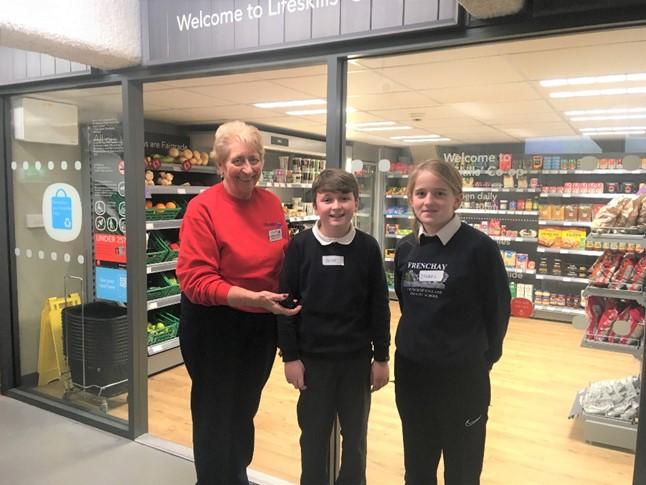 Frenchay pupils with volunteer Donna Butcher outside ‘The Lifeskills Co-op’